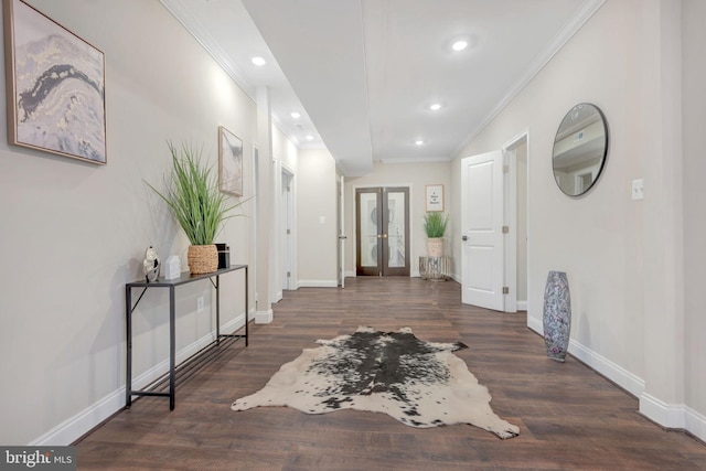 entryway featuring dark hardwood / wood-style flooring, ornamental molding, and french doors