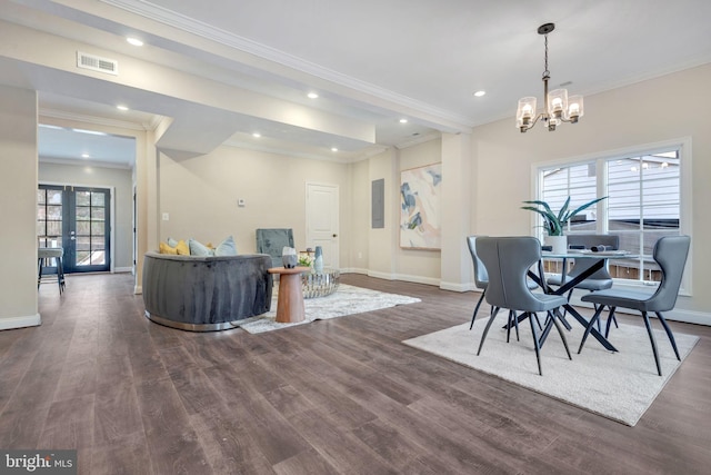 dining room with french doors, crown molding, a chandelier, electric panel, and dark hardwood / wood-style floors