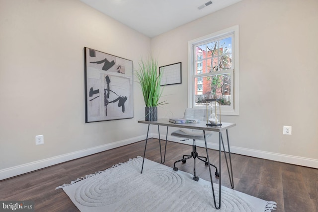 office with dark wood-type flooring