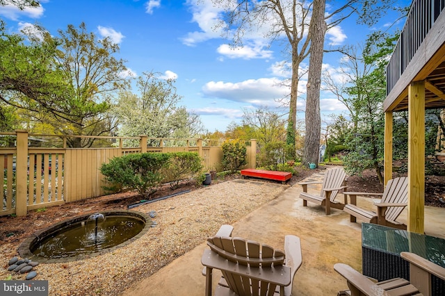 view of patio / terrace featuring fence