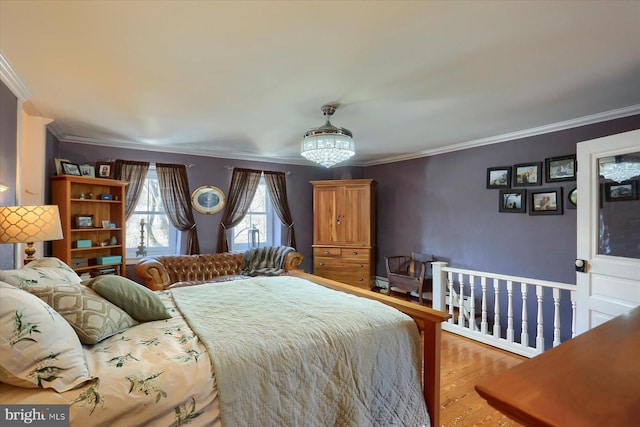 bedroom with hardwood / wood-style floors and ornamental molding