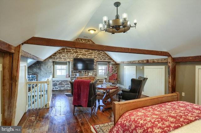 bedroom featuring dark hardwood / wood-style flooring, an inviting chandelier, and lofted ceiling