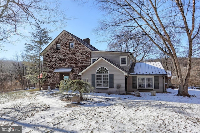 view of snow covered house