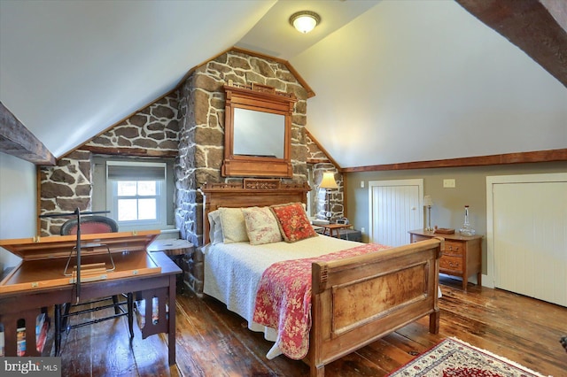 bedroom featuring vaulted ceiling and dark hardwood / wood-style floors