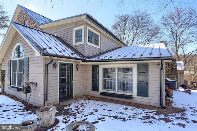 view of snow covered house