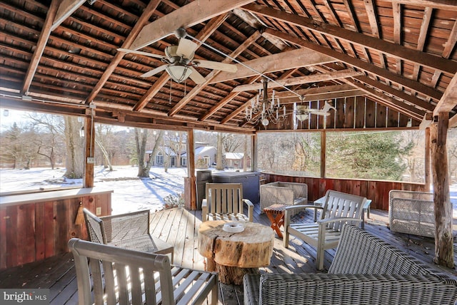 sunroom / solarium with ceiling fan, lofted ceiling, and wooden ceiling