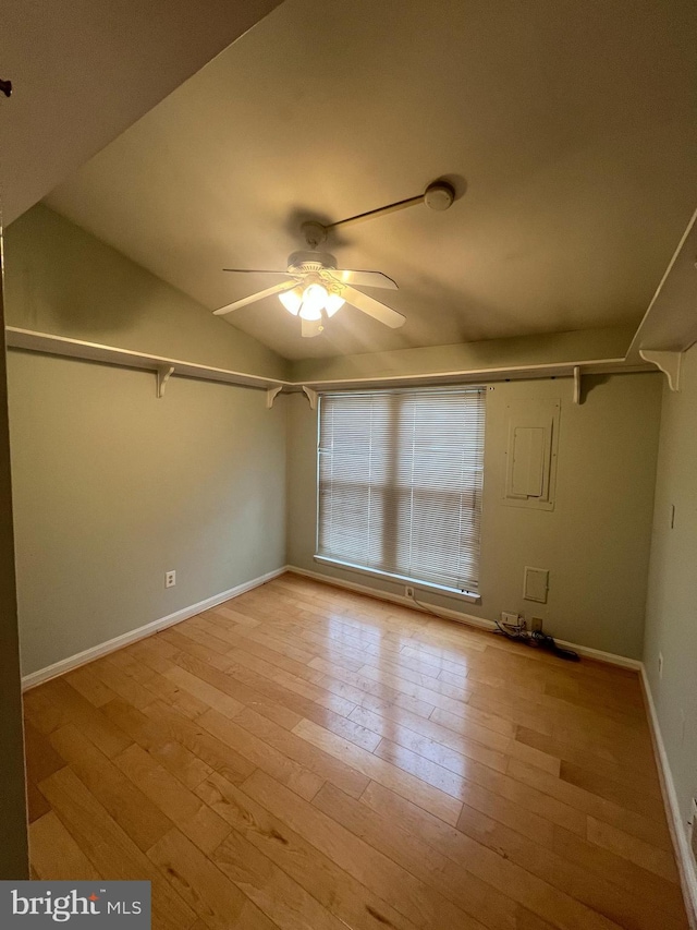 unfurnished room featuring ceiling fan, lofted ceiling, and light hardwood / wood-style flooring