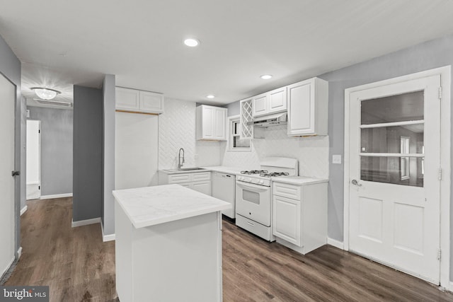 kitchen featuring white cabinets, backsplash, white appliances, and dark hardwood / wood-style flooring