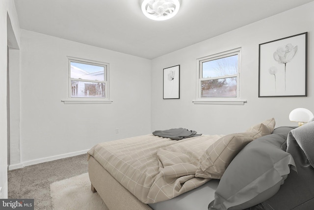 bedroom featuring light colored carpet