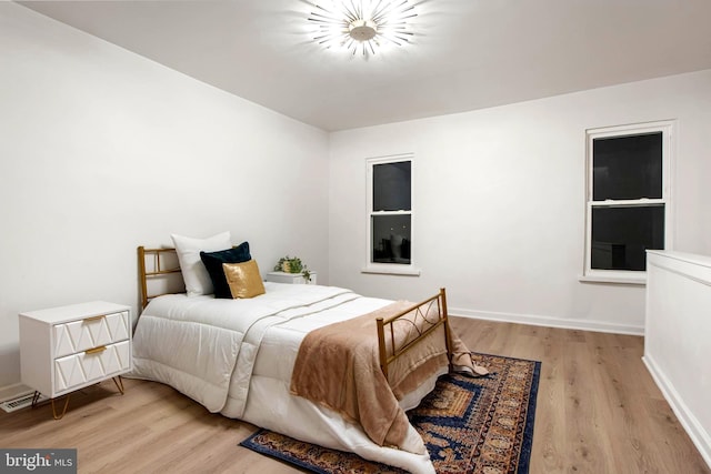 bedroom with light hardwood / wood-style floors