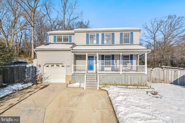 front facade featuring covered porch and a garage