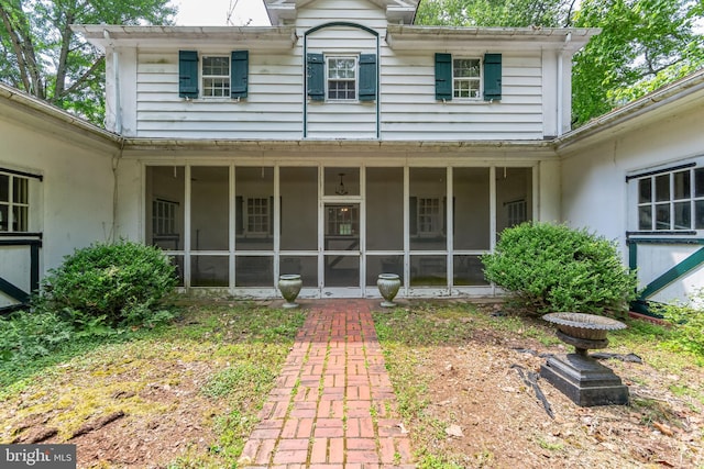 exterior space featuring a sunroom