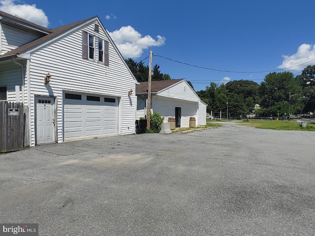 view of side of home with a garage