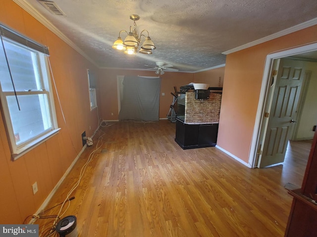 interior space featuring crown molding, a wealth of natural light, and hardwood / wood-style floors