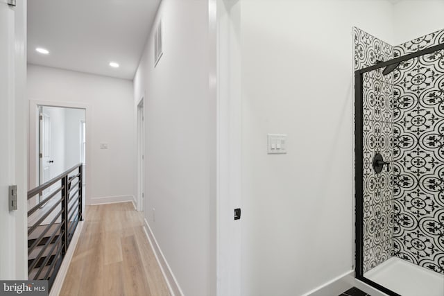 hall with light hardwood / wood-style flooring