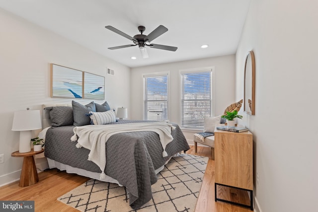 bedroom featuring light hardwood / wood-style floors and ceiling fan