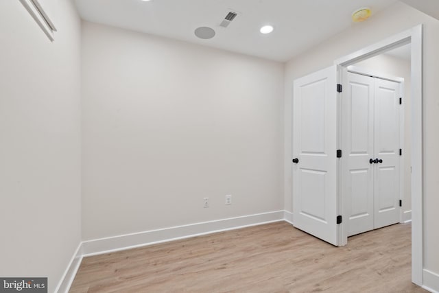 empty room with light hardwood / wood-style floors