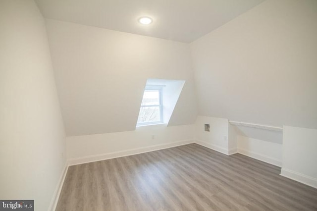 bonus room with hardwood / wood-style floors