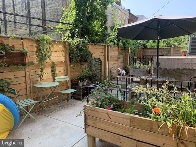 view of patio with central AC