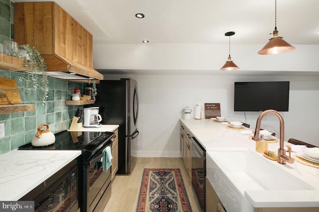 kitchen featuring light stone countertops, sink, dishwasher, electric stove, and decorative backsplash