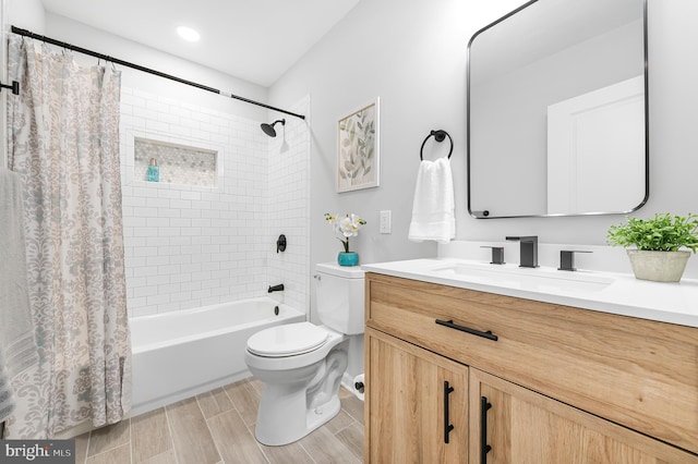 full bathroom with shower / bath combo, vanity, and toilet