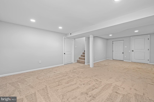 basement with light colored carpet