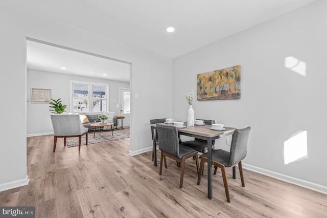 dining area featuring light wood-type flooring