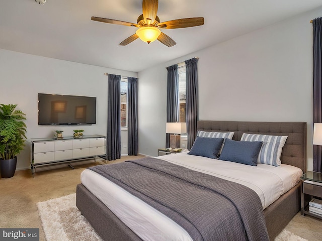 carpeted bedroom featuring ceiling fan