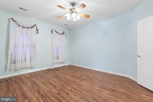 empty room featuring wood-type flooring and ceiling fan