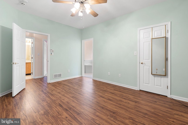 unfurnished bedroom with dark hardwood / wood-style floors and ceiling fan