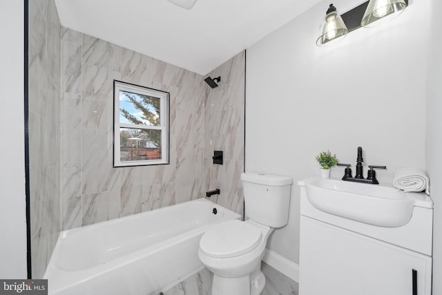 full bathroom with vanity, toilet, and tiled shower / bath