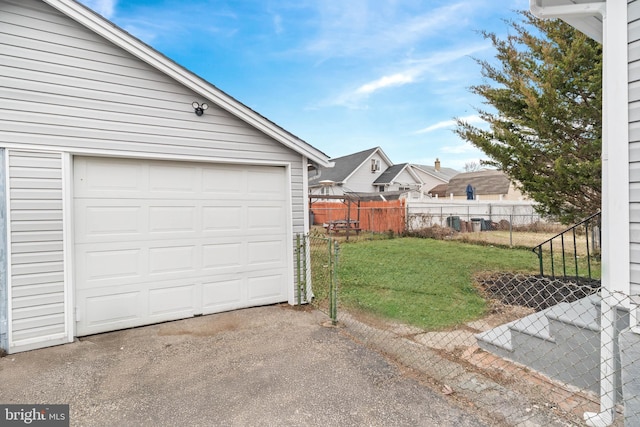 garage with a lawn