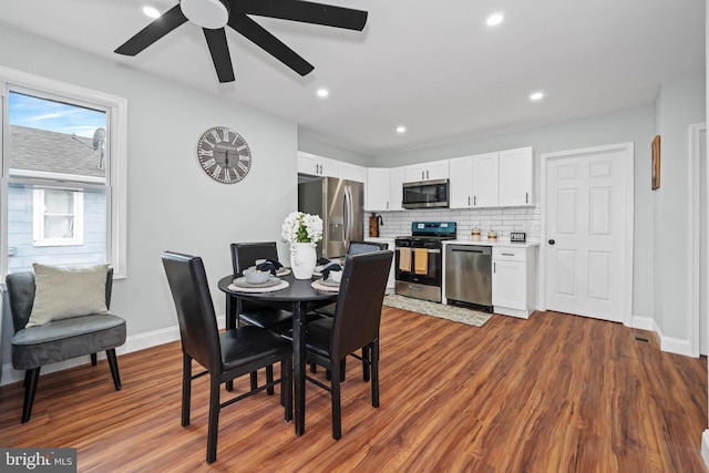 dining room featuring hardwood / wood-style floors and ceiling fan