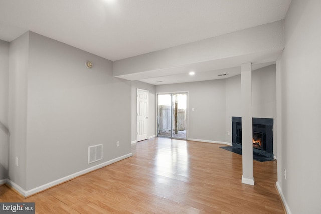 unfurnished living room with light hardwood / wood-style floors