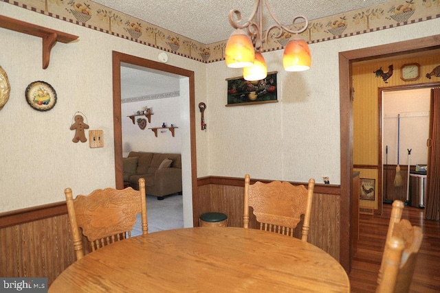 dining space featuring a textured ceiling