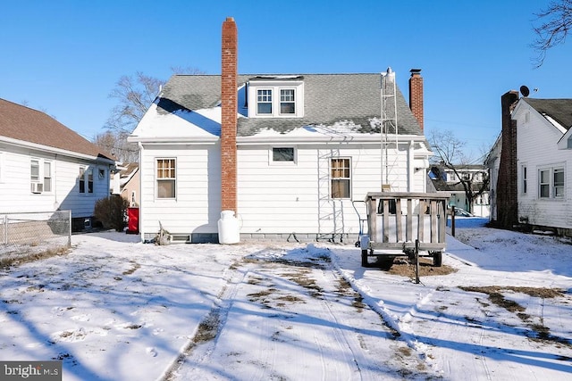 view of snow covered house