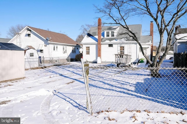 view of snow covered house