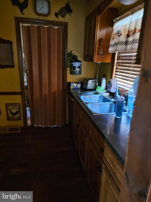 kitchen featuring stainless steel dishwasher and sink