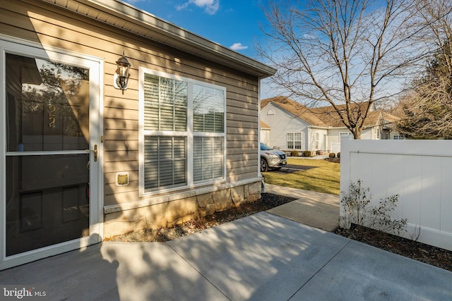 view of side of home with a patio