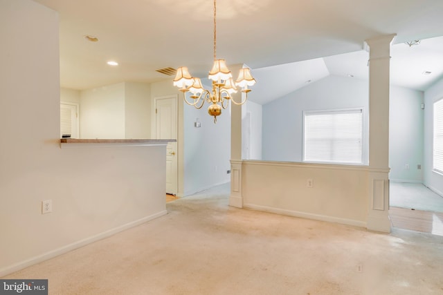 unfurnished room with vaulted ceiling, light colored carpet, a wealth of natural light, and a chandelier