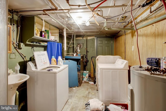 laundry room featuring separate washer and dryer and water heater