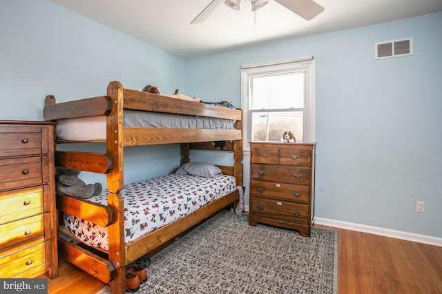 bedroom featuring wood-type flooring and ceiling fan