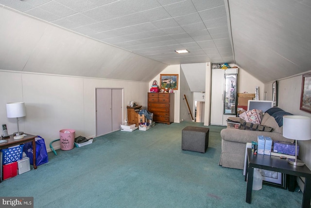 interior space featuring carpet and vaulted ceiling