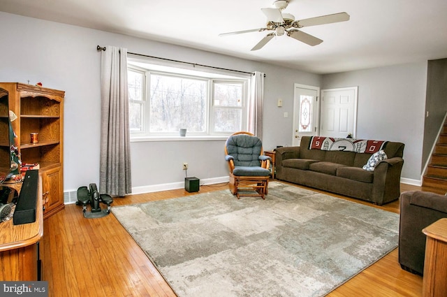 living room with hardwood / wood-style floors and ceiling fan