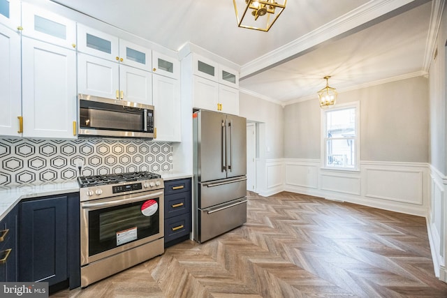 kitchen with white cabinetry, light parquet flooring, hanging light fixtures, and appliances with stainless steel finishes