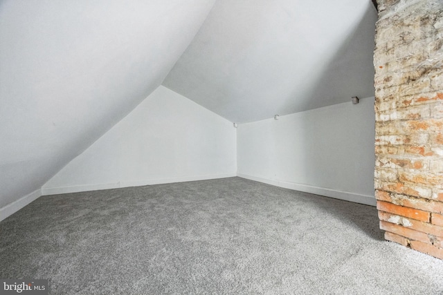 bonus room featuring carpet and vaulted ceiling