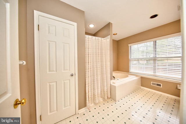 bathroom with independent shower and bath