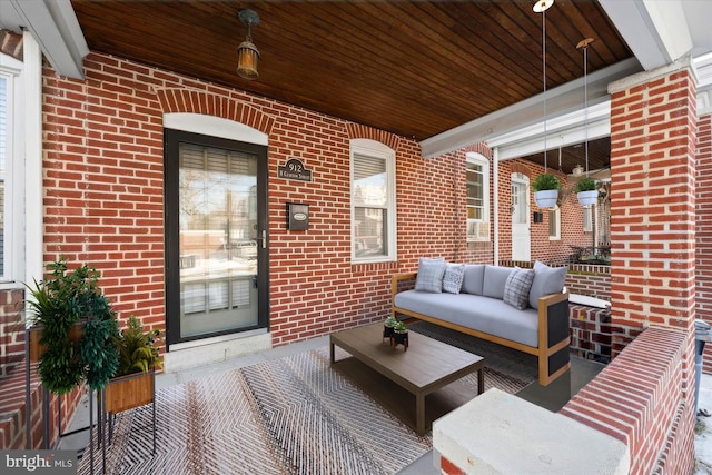 view of patio with a porch and an outdoor living space