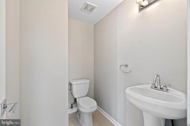 bathroom with toilet and sink