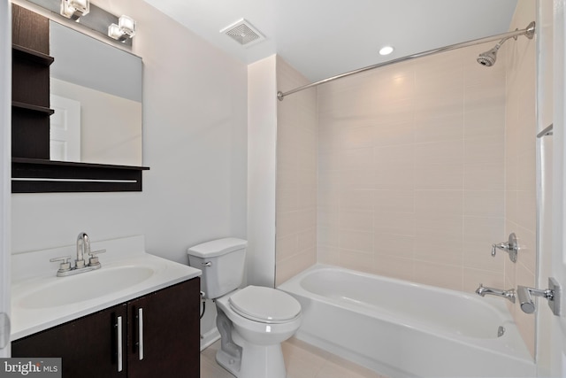 full bathroom with vanity, tiled shower / bath combo, and toilet